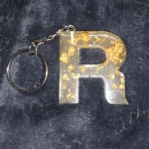 R Clear with gold leaf resin key chain.